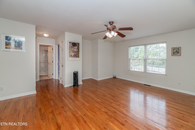 unfurnished living room with ceiling fan and light wood-type flooring