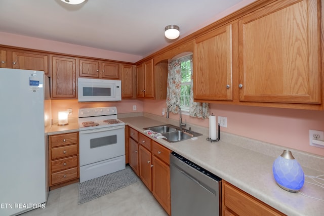 kitchen with white appliances and sink