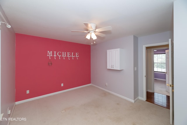 carpeted empty room with ceiling fan