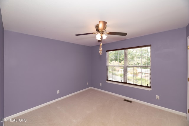 unfurnished room featuring carpet and ceiling fan