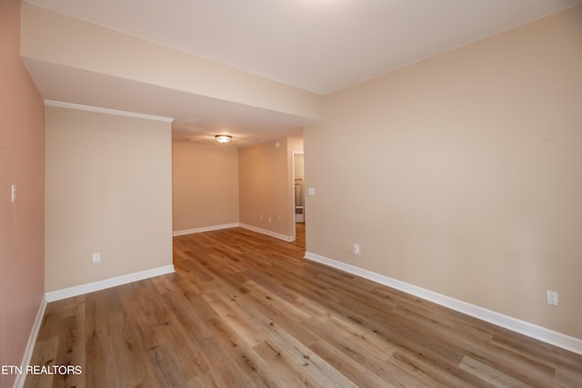 empty room with light hardwood / wood-style flooring