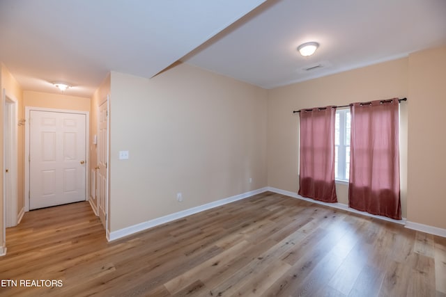 empty room featuring light hardwood / wood-style floors