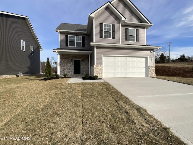 view of front property with a garage and a front yard