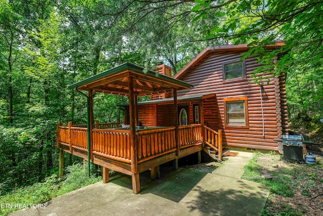 exterior space featuring a wooden deck