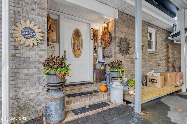 view of exterior entry featuring a porch