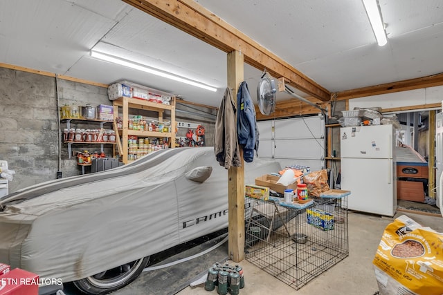 garage with white refrigerator