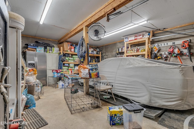 basement with stainless steel refrigerator with ice dispenser