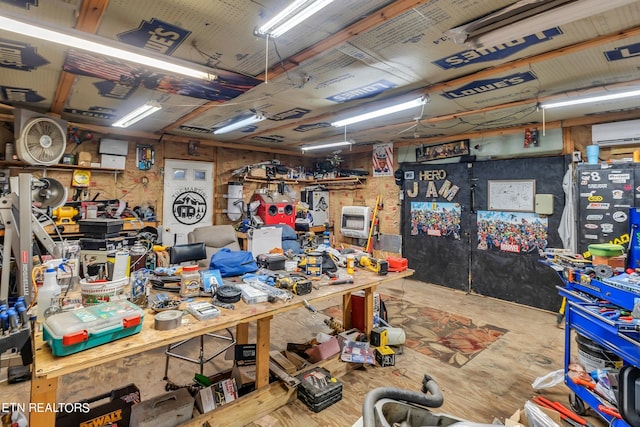 miscellaneous room with a workshop area and a wall mounted AC