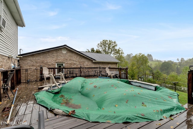 view of pool featuring a wooden deck