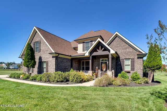 craftsman-style home with a front lawn