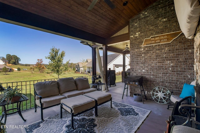 view of patio featuring ceiling fan and an outdoor living space