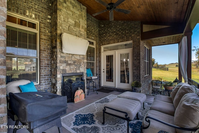 view of patio with outdoor lounge area, french doors, and ceiling fan