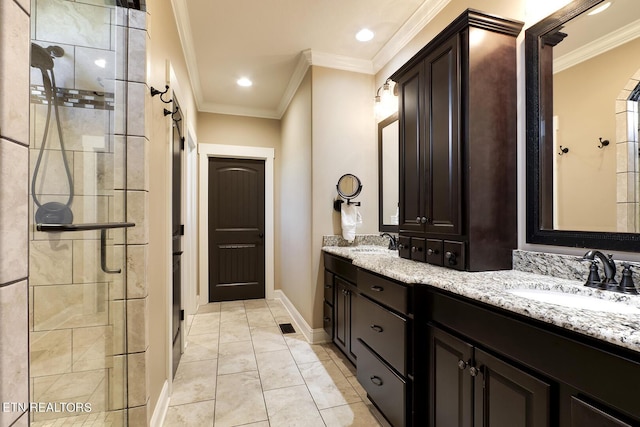 full bathroom with a sink, ornamental molding, tiled shower, and double vanity