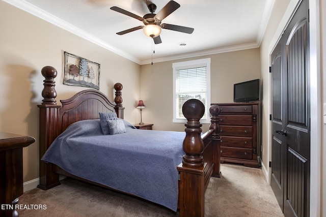 bedroom with a ceiling fan, carpet flooring, baseboards, and ornamental molding