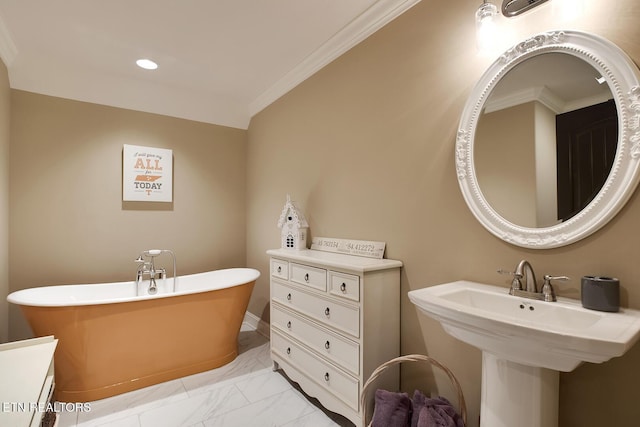 full bath with crown molding, a freestanding bath, marble finish floor, and recessed lighting