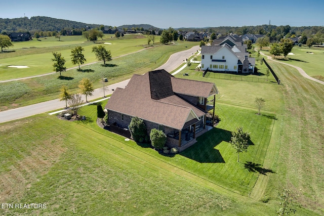 birds eye view of property with a mountain view