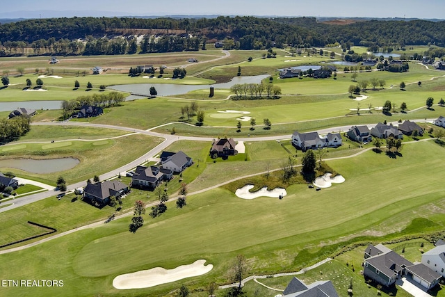 bird's eye view with a water view, golf course view, and a residential view