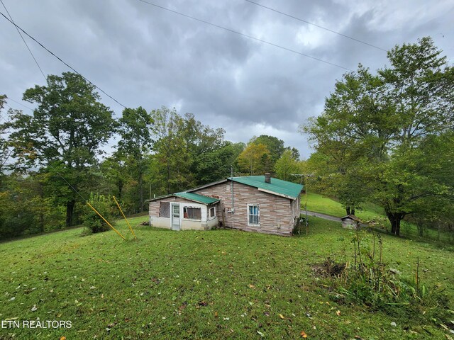 exterior space with a yard