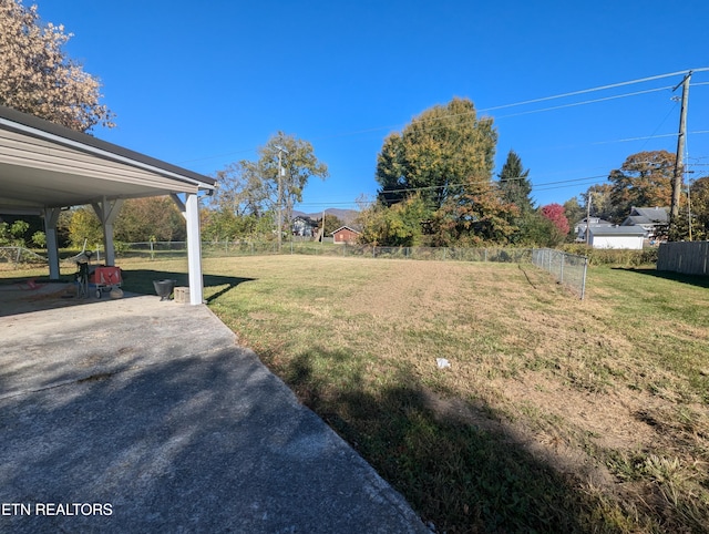 view of yard with a patio and fence