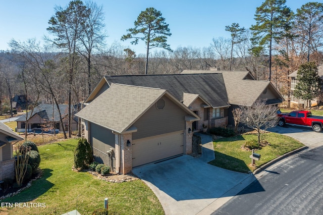 view of front of home featuring a front lawn, brick siding, driveway, and a shingled roof