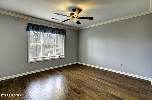 empty room featuring visible vents, baseboards, and dark wood finished floors