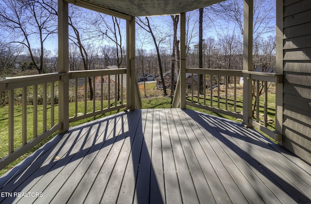 deck featuring a lawn