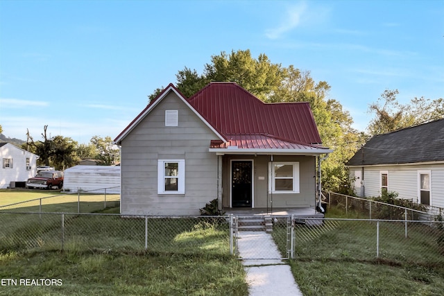 bungalow-style house with a front yard