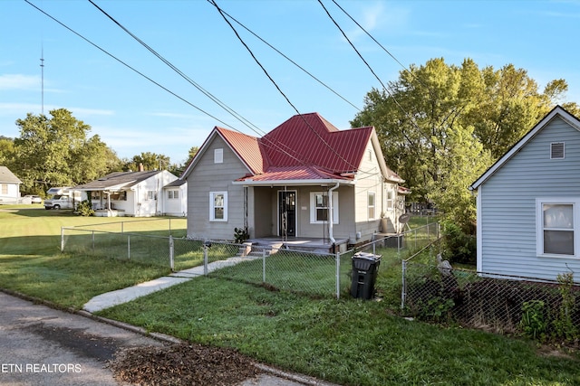 bungalow-style home with a front lawn