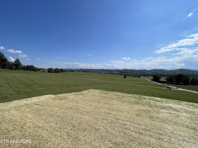 exterior space with a rural view