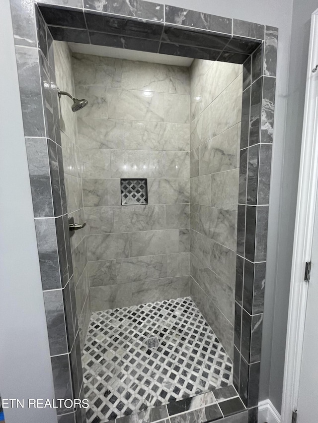 bathroom featuring a shower stall
