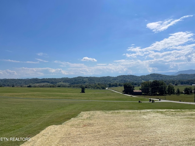 mountain view featuring a rural view