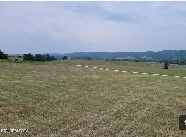 property view of mountains featuring a rural view