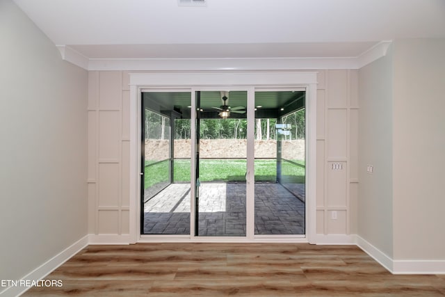 doorway to outside featuring ceiling fan and light hardwood / wood-style flooring