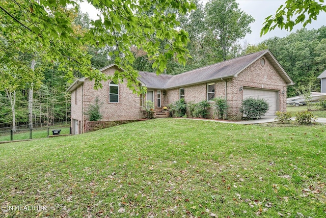 ranch-style home with a garage and a front lawn