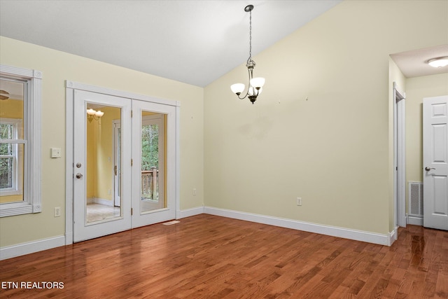 interior space featuring wood-type flooring and a healthy amount of sunlight