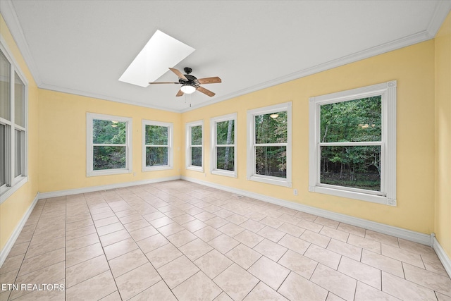 unfurnished sunroom with a skylight and ceiling fan