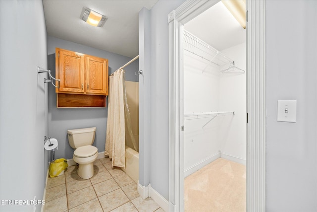 bathroom with tile patterned flooring, toilet, and shower / tub combo with curtain