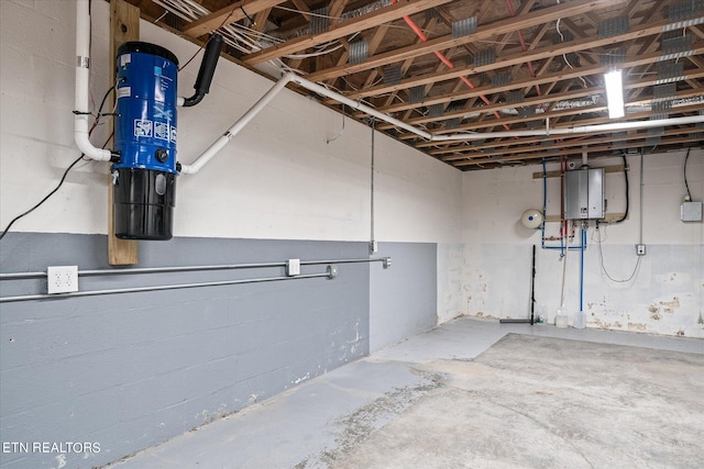 basement featuring tankless water heater