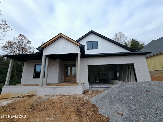 view of front facade featuring a garage and covered porch