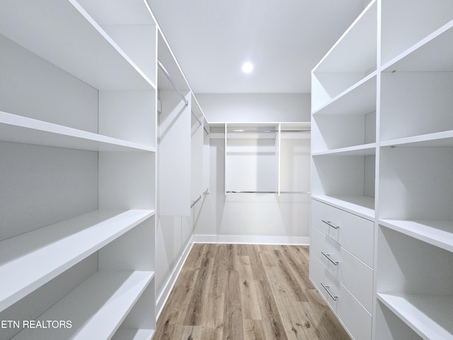 spacious closet with wood finished floors