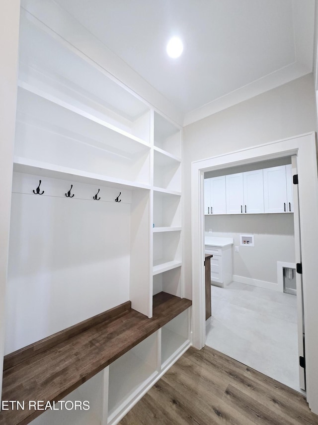 mudroom with wood finished floors