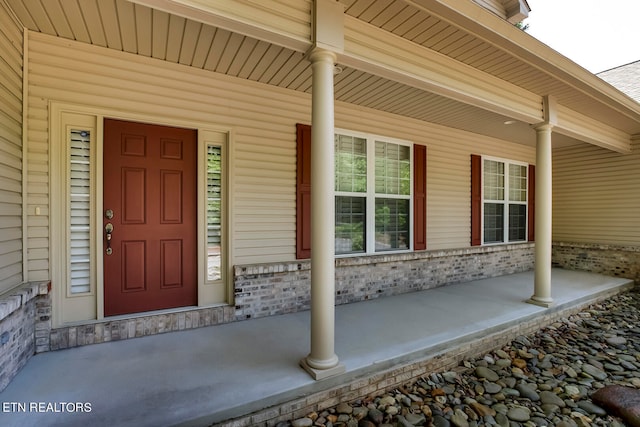 doorway to property with a porch