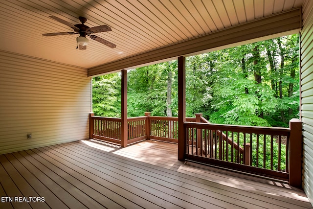 wooden terrace featuring ceiling fan