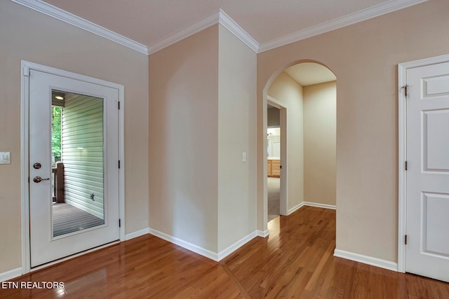 interior space with light hardwood / wood-style flooring and crown molding