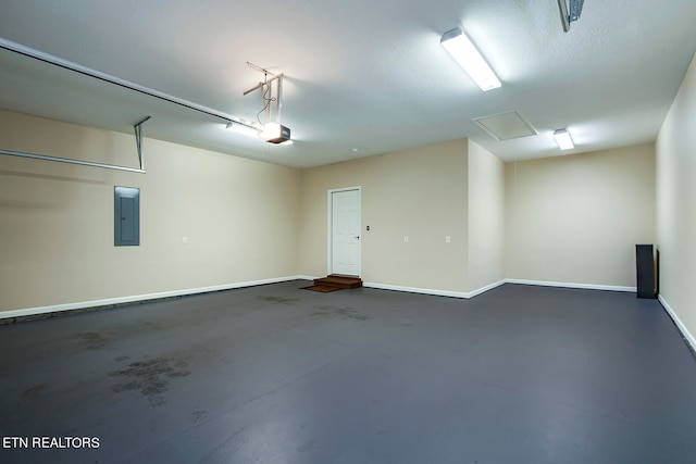 garage with a garage door opener and electric panel