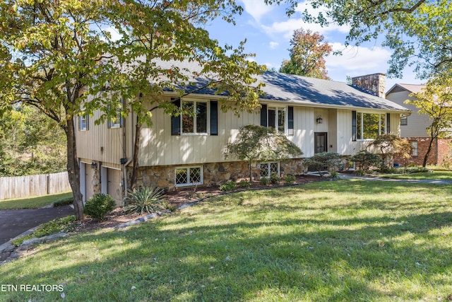 bi-level home with a front yard