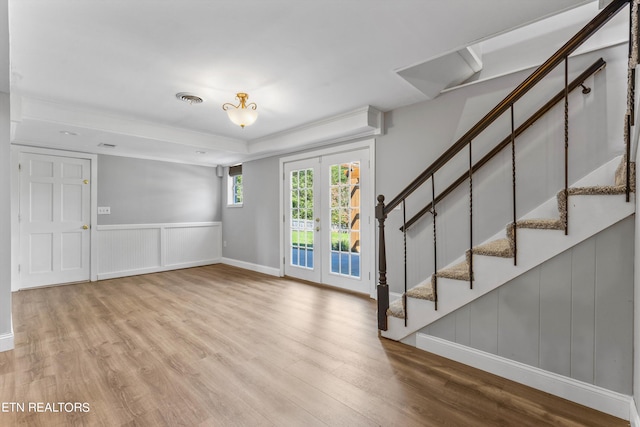 interior space with light hardwood / wood-style flooring and french doors