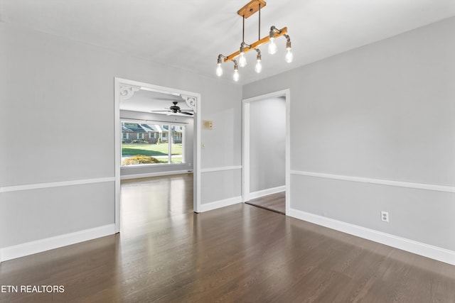 unfurnished dining area with ceiling fan and dark hardwood / wood-style flooring