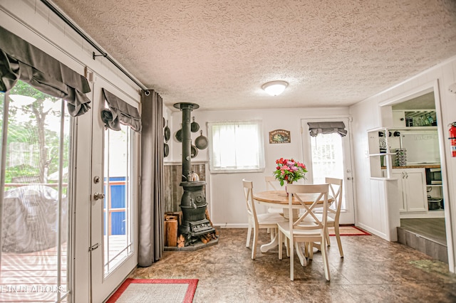 dining space featuring a textured ceiling