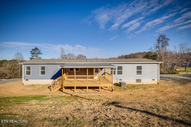 rear view of house featuring crawl space, cooling unit, and a wooden deck